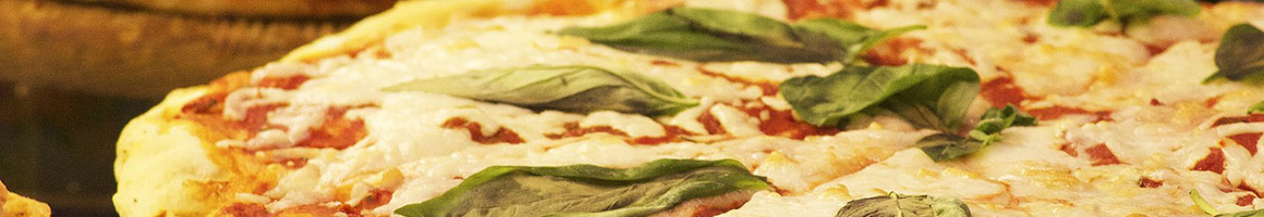 Eating Italian Pizza at Veneto Wood Fired Pizza & Pasta restaurant in Rochester, NY.